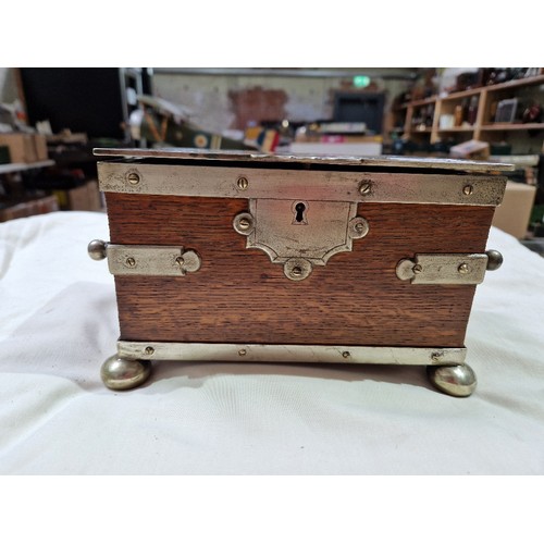 103 - A silver plated oak tea caddy, circa 1900, the tope engraved with butterflies and acorns.