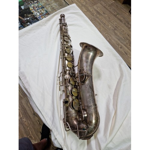 203 - An American tenor saxophone marked 'Martin, Elkhart Ind', 'LOW PITCH', serial no.108530, with hard c... 