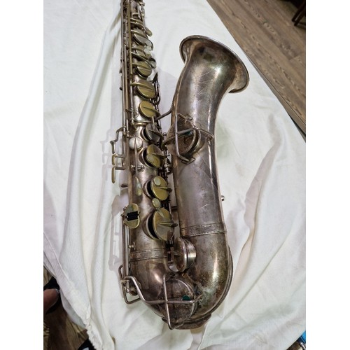 203 - An American tenor saxophone marked 'Martin, Elkhart Ind', 'LOW PITCH', serial no.108530, with hard c... 