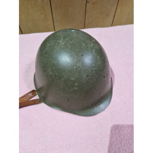 175 - A WWII Bulgarian helmet and three others.