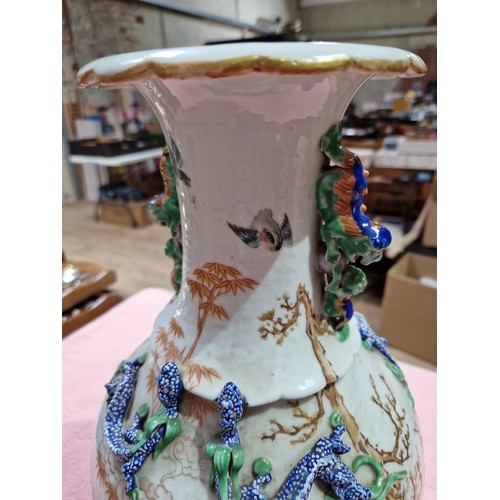 123 - A Chinese porcelain vase, mid 19th century, decorated in over enamels with boats and figures, applie... 