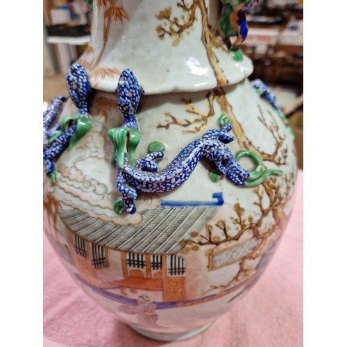 123 - A Chinese porcelain vase, mid 19th century, decorated in over enamels with boats and figures, applie... 