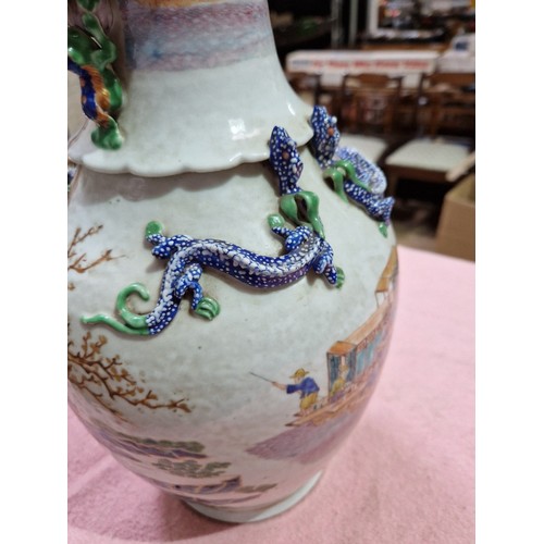 123 - A Chinese porcelain vase, mid 19th century, decorated in over enamels with boats and figures, applie... 