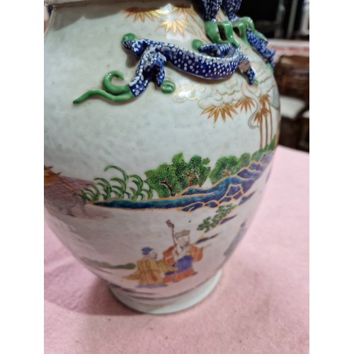 123 - A Chinese porcelain vase, mid 19th century, decorated in over enamels with boats and figures, applie... 