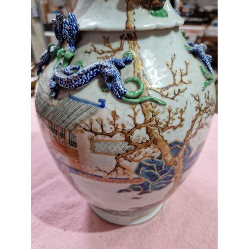 123 - A Chinese porcelain vase, mid 19th century, decorated in over enamels with boats and figures, applie... 