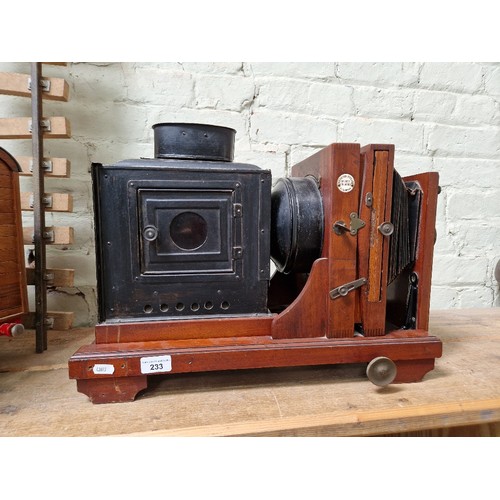 233 - A mahogany Thornton-Pickard 'Ruby' enlarger/magic lantern, circa 1900.