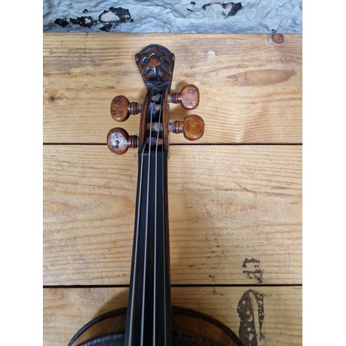 201 - A German 19th century violin, one piece back, length 355mm, with bow stamped Homa, in hard case.