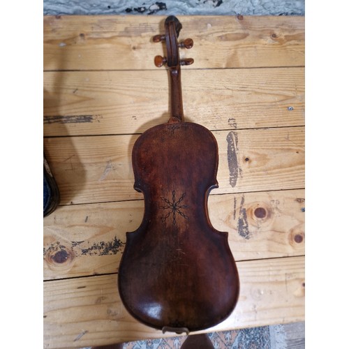 201 - A German 19th century violin, one piece back, length 355mm, with bow stamped Homa, in hard case.