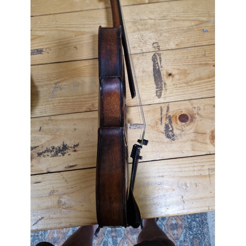 201 - A German 19th century violin, one piece back, length 355mm, with bow stamped Homa, in hard case.