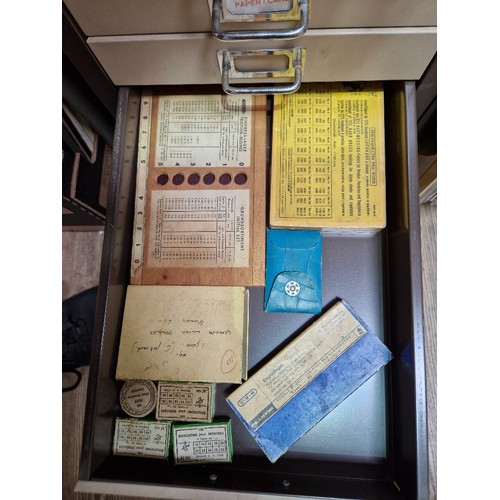 74A - A 15 drawer triumph metal cabinet and contents comprising of clock making spares.