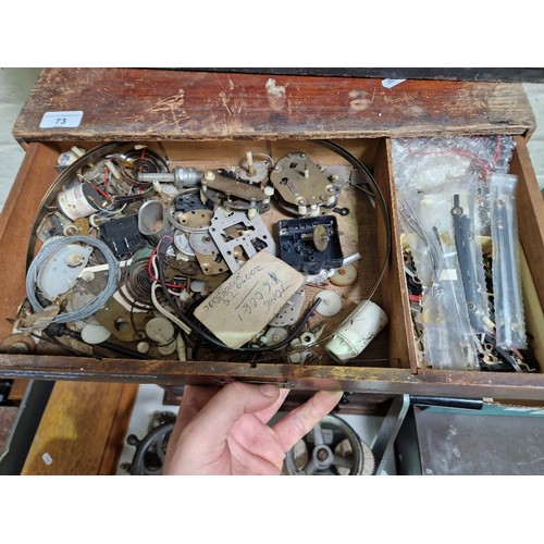 73 - A five drawer horologist's chest and contents comprising watch and clock making spares.