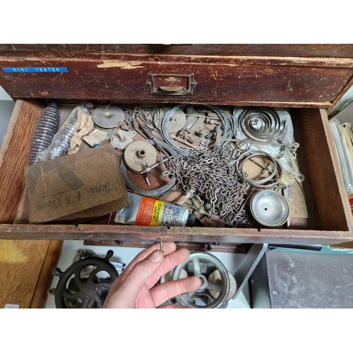 73 - A five drawer horologist's chest and contents comprising watch and clock making spares.