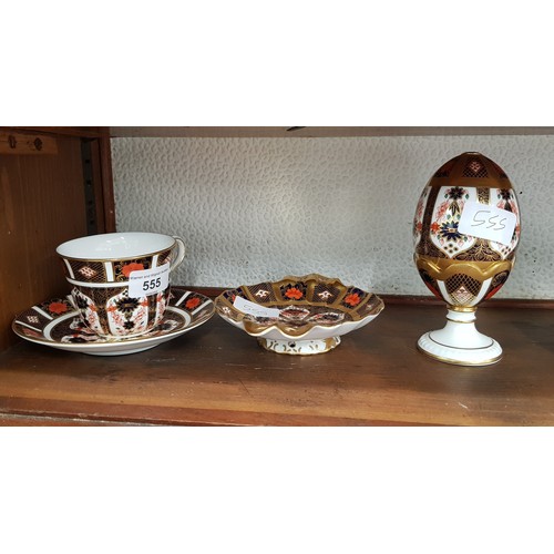 555 - Royal Crown Derby cup and saucer, small dish and egg on stand