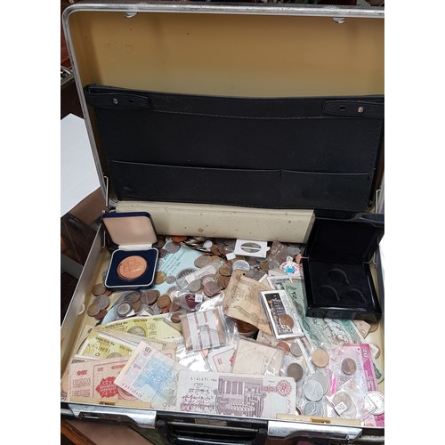 562 - A case of assorted world coins, banknotes and medallions etc.