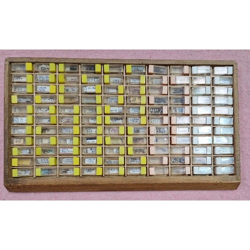 77 - Wooden, plastic and metal cabinets of watch spares.