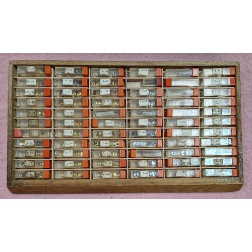 77 - Wooden, plastic and metal cabinets of watch spares.