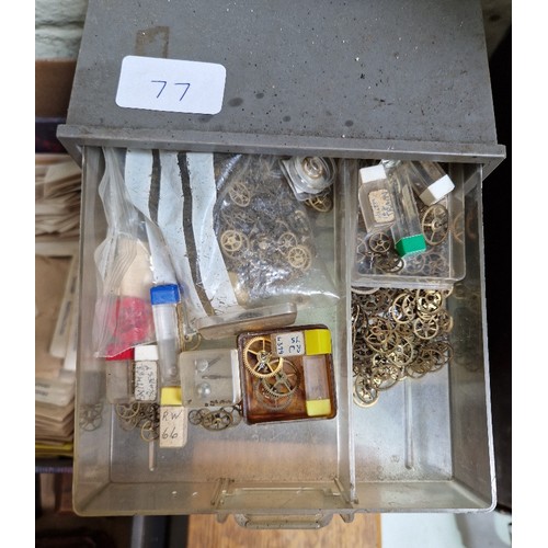 77 - Wooden, plastic and metal cabinets of watch spares.