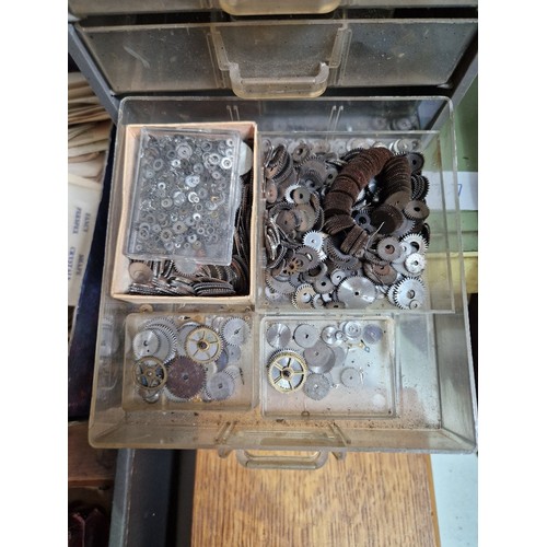 77 - Wooden, plastic and metal cabinets of watch spares.