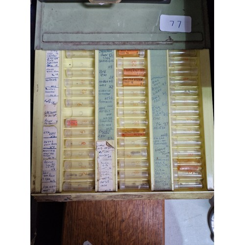 77 - Wooden, plastic and metal cabinets of watch spares.