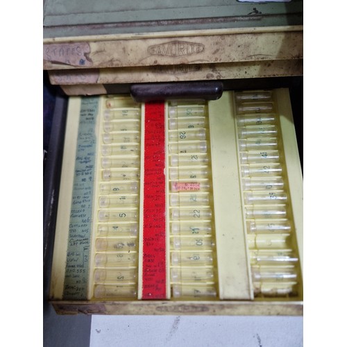 77 - Wooden, plastic and metal cabinets of watch spares.