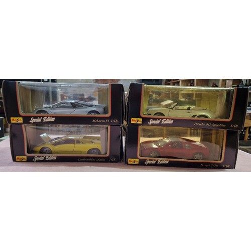 490 - Two boxes of mainly die-cast vehicles including Burago and Maisto.