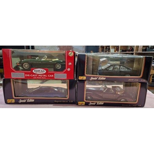 490 - Two boxes of mainly die-cast vehicles including Burago and Maisto.