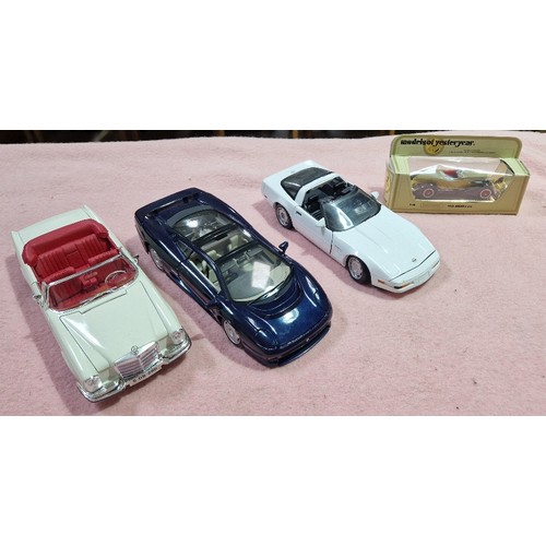 490 - Two boxes of mainly die-cast vehicles including Burago and Maisto.