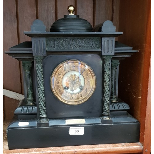 66 - A black slate mantel clock.