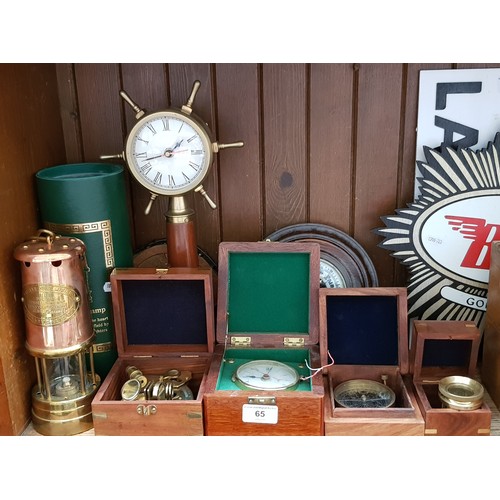 65 - A group of assorted reproduction brass instruments fitted in boxes, a miner's lamps etc.