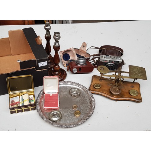 85 - A mixed lot of collectables including a 1925 school cap with tassel, vintage cameras, postage scales... 