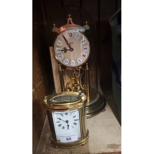 95 - A German mantle clock under dome and a French carriage clock.