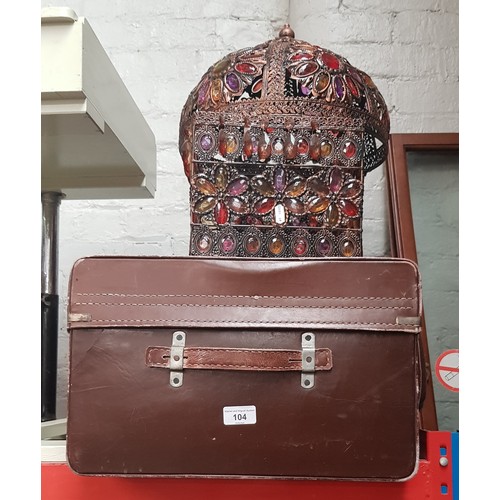 104 - A vintage case and three coloured glass light shades.