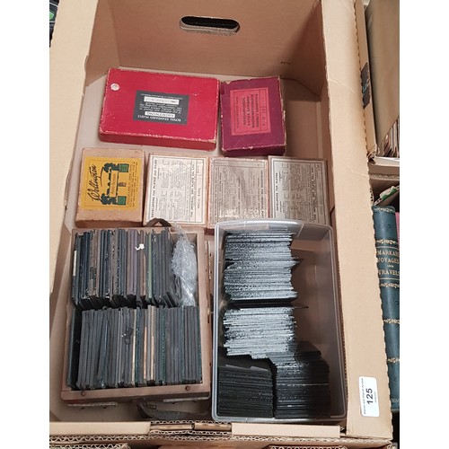 125 - A box of assorted lantern slides and glass plate negatives.