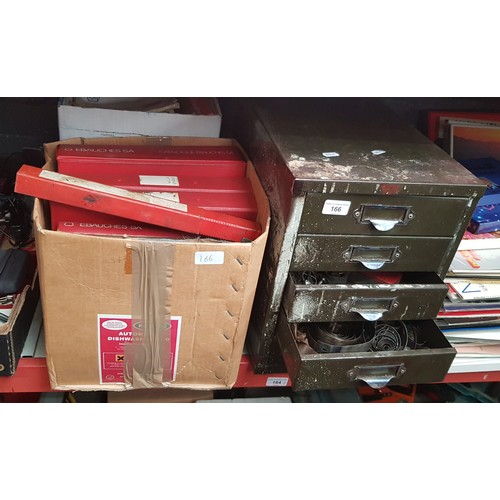 166 - A metal cabinet of mainly clock parts and two boxes of watch part catalogues.