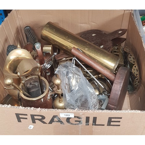 182 - A box of assorted brassware.