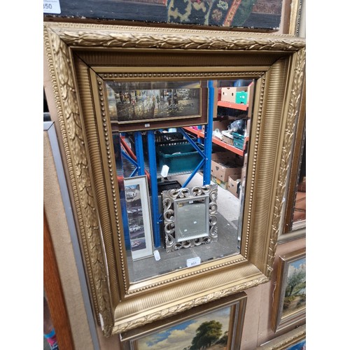 851 - A gilt framed mirror, late 19th century frame, later bevelled glass mirror, 51cm x 66cm.