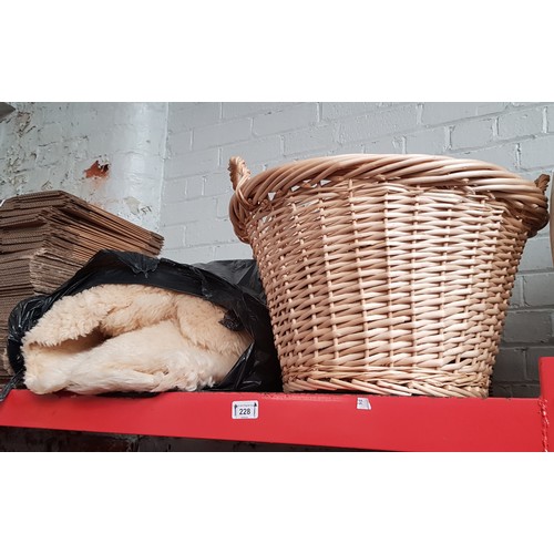 228 - Various wicker baskets and a sheepskin rug