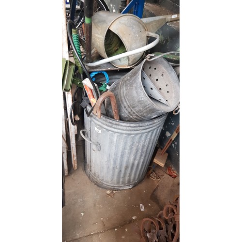 250 - A garden wheelbarrow,a galvanised dustbin, watering can, mop bucket, garden sprayer, crowbar, spirit... 