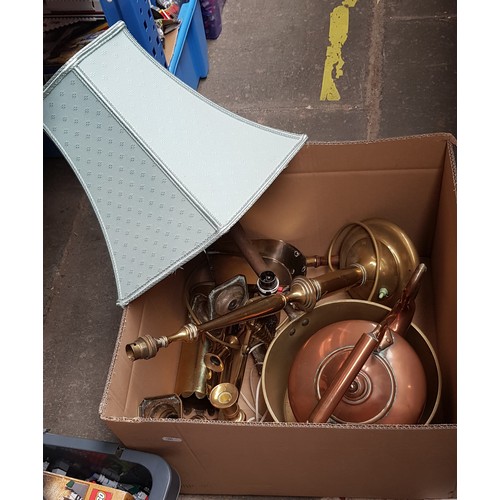 323 - A box of metalware to include large copper kettle, brass jam pan and other brass wares