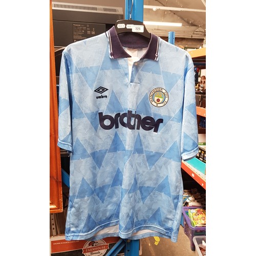 325 - A 1990s Manchester City football shirt.