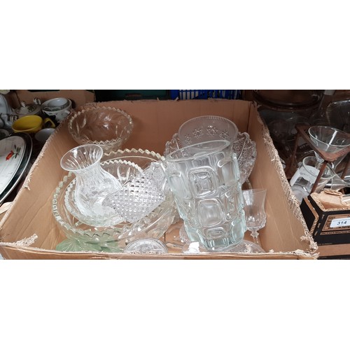 315 - A box of assorted glassware including bowls, vases etc