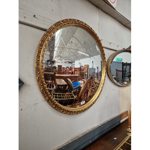 907 - A vintage convex mirror, gilt frame, diameter 67cm.