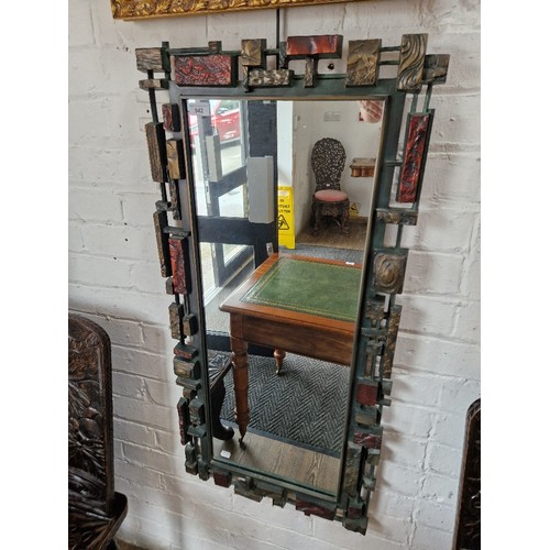 942 - A mid 20th century Brutalist style mirror by Syroco, 50cm 107cm.