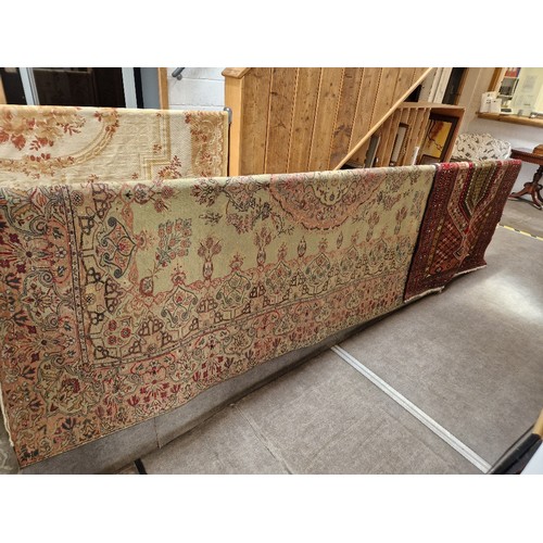 954 - A Turkish wool carpet, green ground, 285cm x 192xm (approx) together with an Eastern hand knotted wo... 