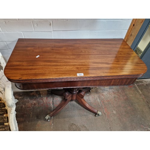 965 - A Regency mahogany pedestal tea table with reeded detail and brass lion paw feet, height 75cm, width... 