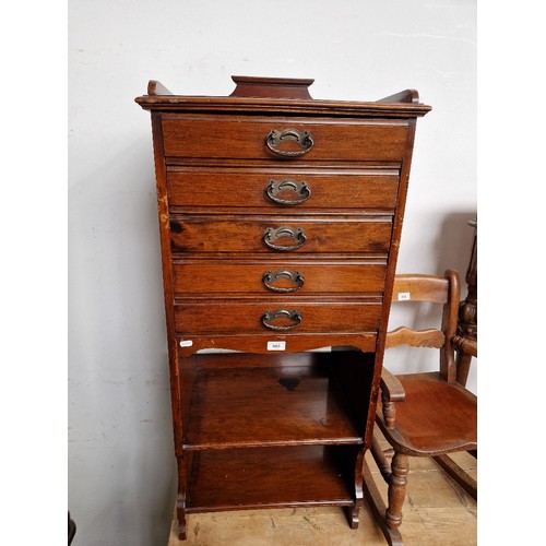 969 - An Edwardian mahogany music cabinet.