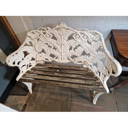 964 - A Coalbrookdale style fern pattern cast iron garden bench, length 116.5cm and height 89cm.