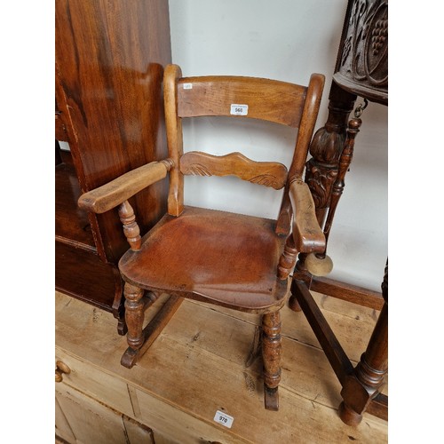 968 - A 19th century beech child's rocking chair.