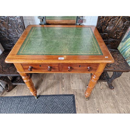 962 - A Victorian mahogany two drawer writing table with tooled leather top, height 72.5cm, width 77.5cm a... 