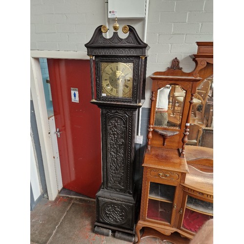 1010 - A Georgian carved oak 8 day longcase clock with brass dial, by John Farley, Fecit, complete with wei... 